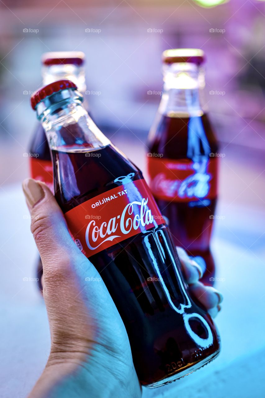 coca cola bottle in hand