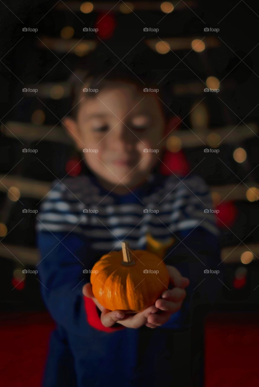 Little boy and little pumpkin