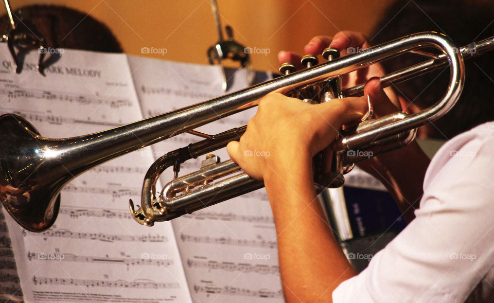 trumpet player reading music