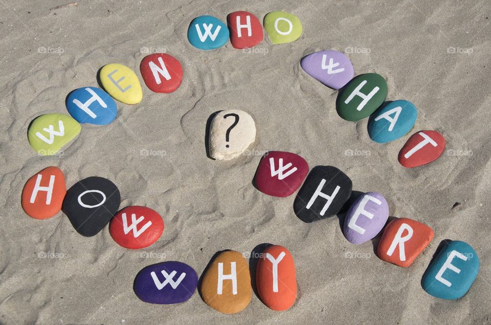 Cloud of questions on colourful stones