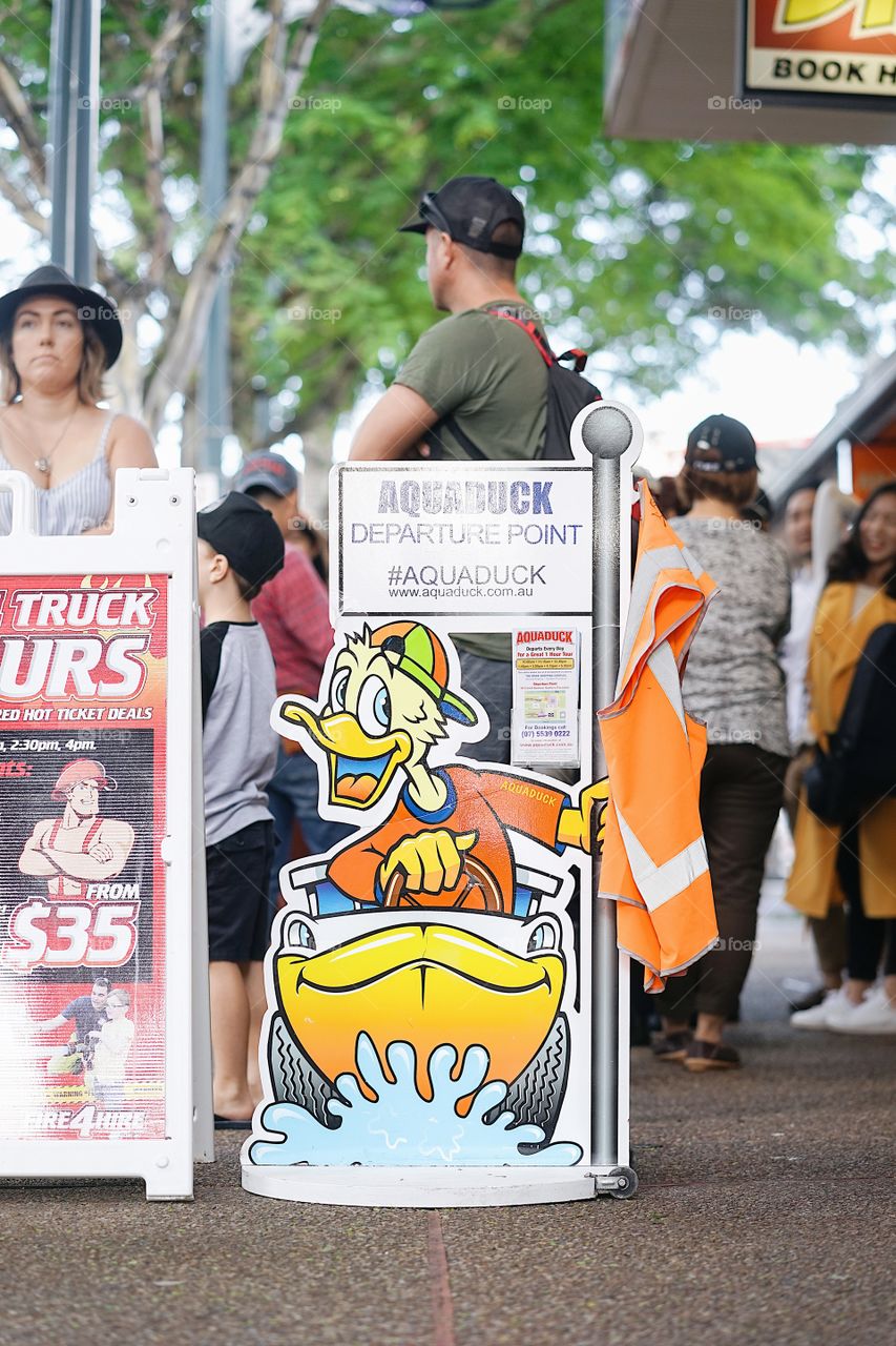 Surfer Paradise, Australia - April 19, 2018 : A photo of Aquaduck advertising board. Aquaduck is a water coaster amphibious tourist vehicle that can drive on land and sea. It is one of a popular attractions and sightseeing for visitors. 