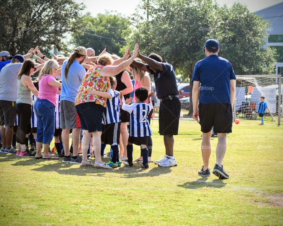 After a soccer game, families and friends come together to celebrate the efforts and hard work of the little players. With so much love and support, an appreciative hug comes so naturally. 