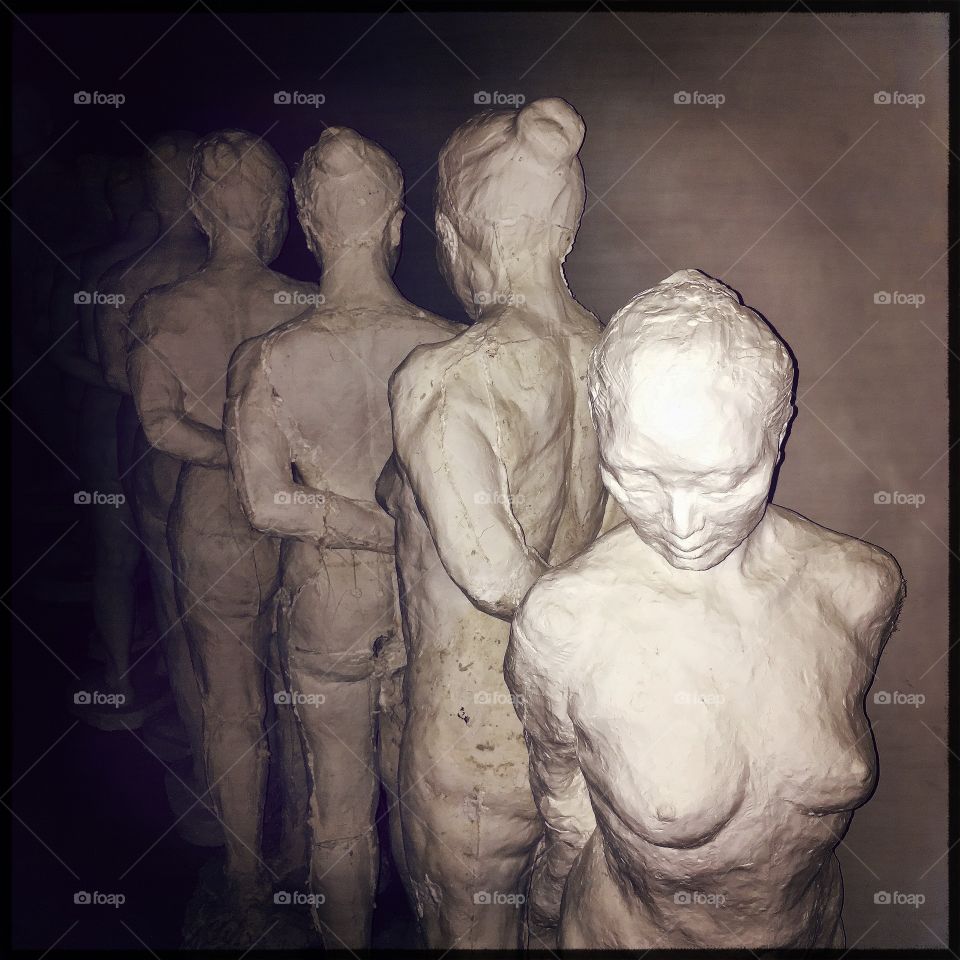 Sculptures of women in the art department corridor 