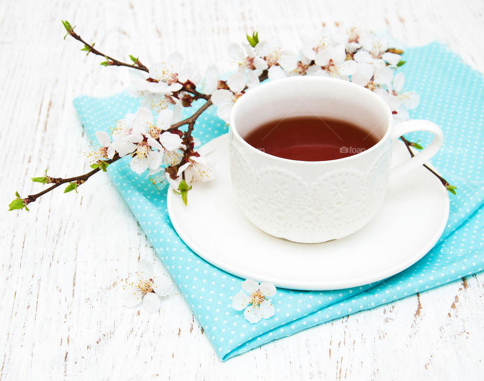 Cup of tea and spring blossom 