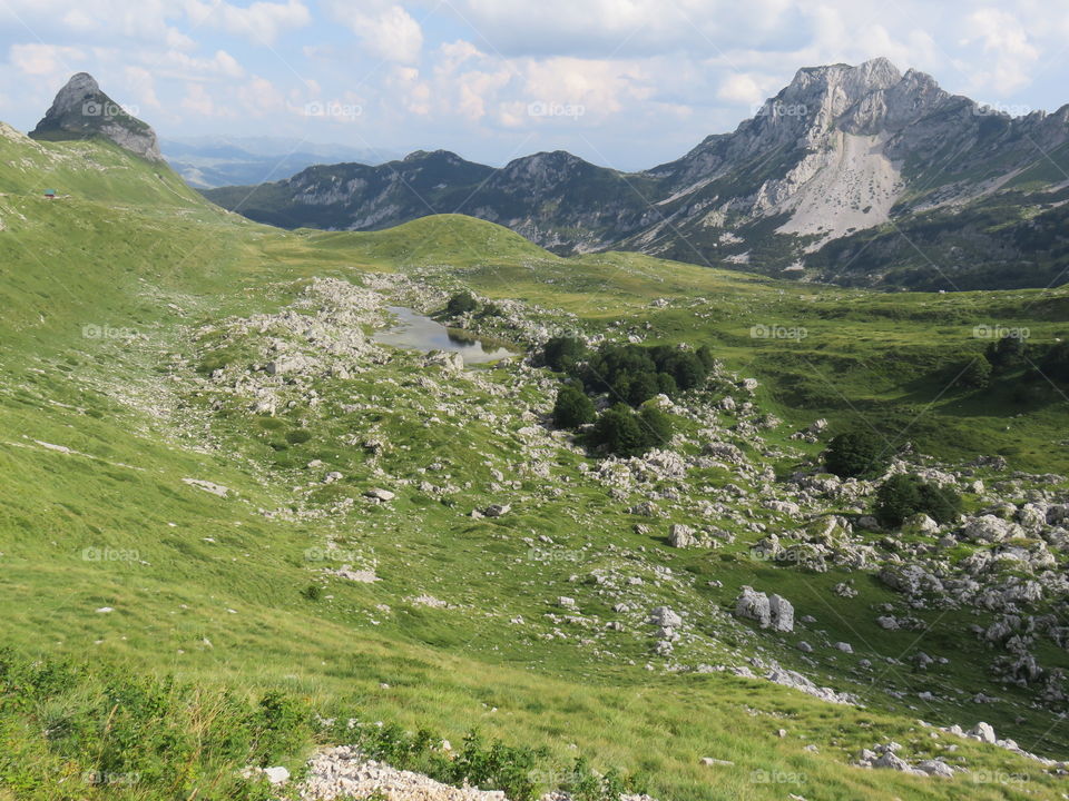 Mountain landscape rocky with green vegetation