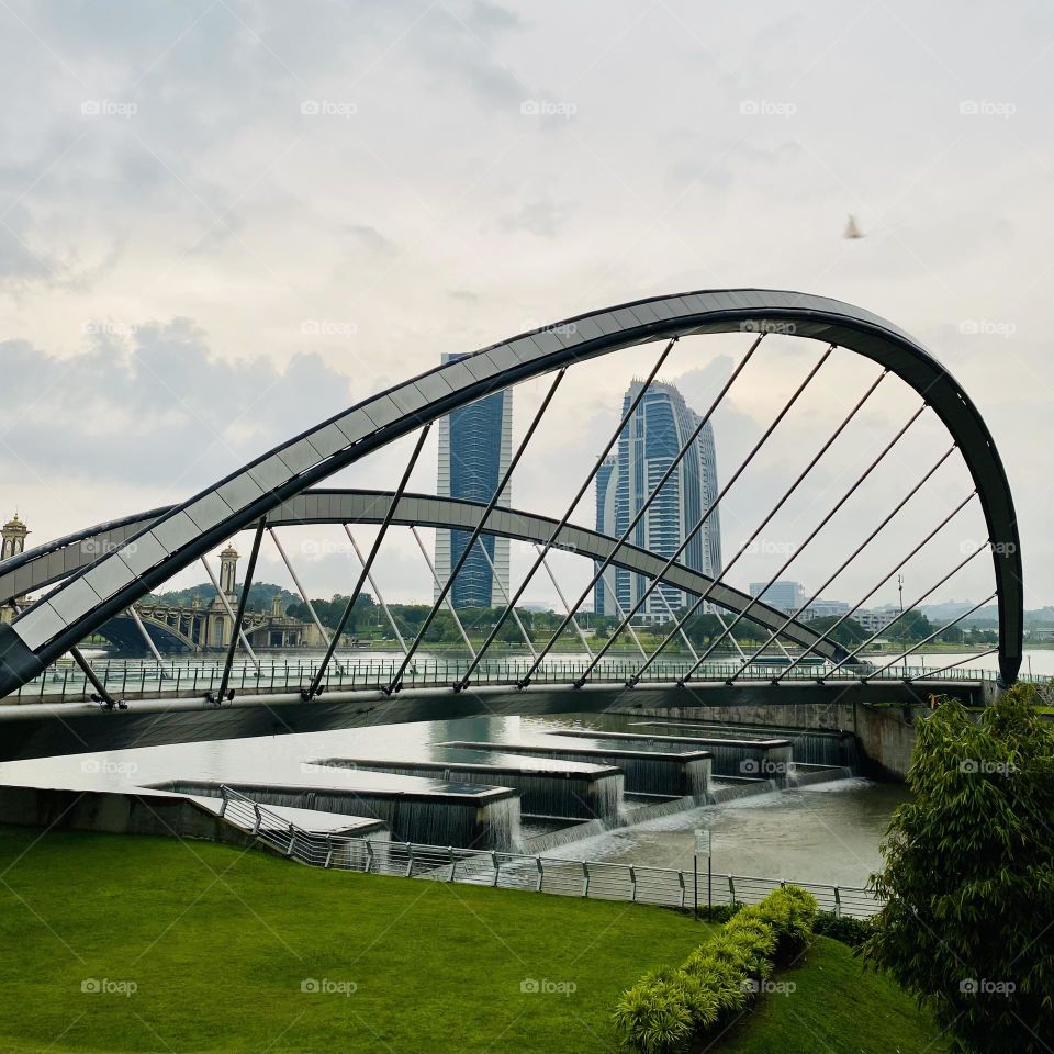 Modern architecture design of a dam and bridge in Putrajaya, Malaysia.