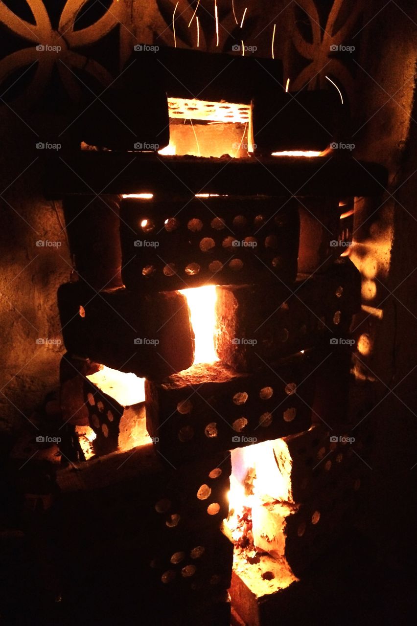 My homemade brick style fire pit, lit up like a lantern 