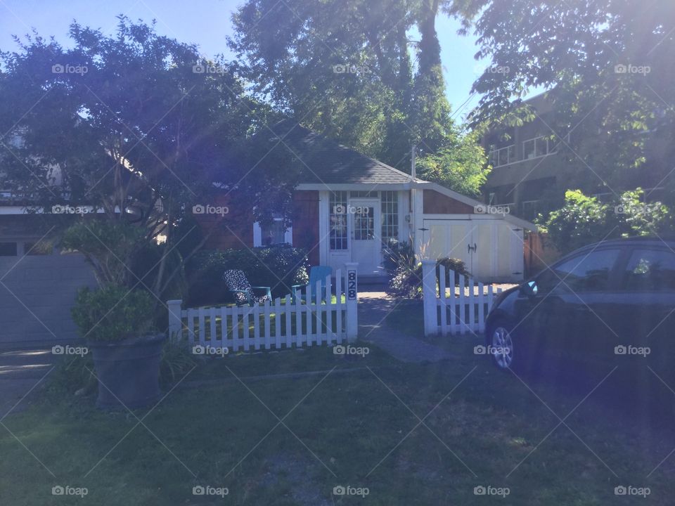 Little house with a white picket fence 