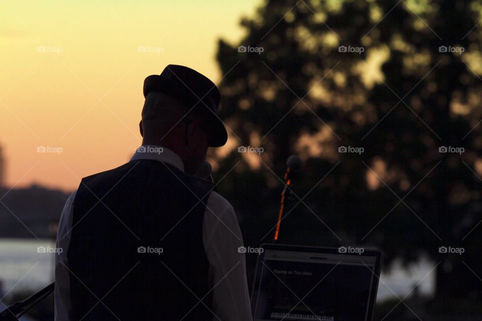 Sunset and Music. Musician plays during sunset in New York City 