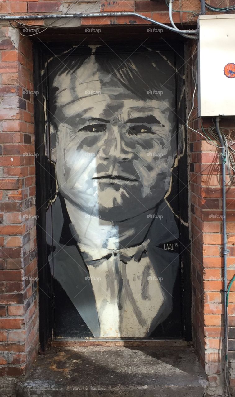 Butch Cassidy Mural in an Alley Doorway