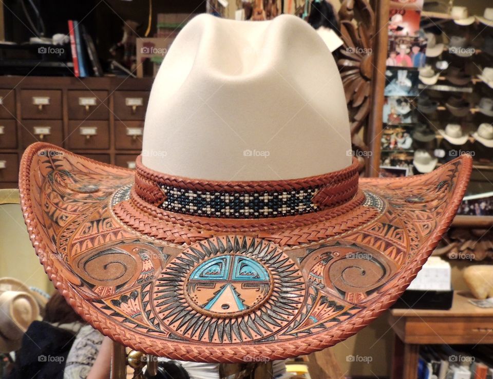 Cowboy hat embellished with leathet