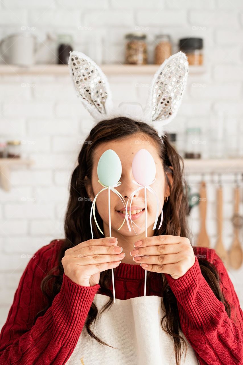 Easter scene woman coloring eggs at home