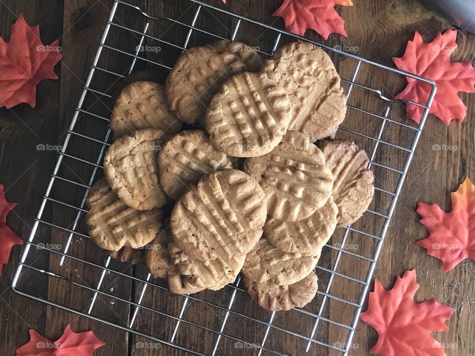 Flat lay peanut butter cookies on a rack with maple leaves 