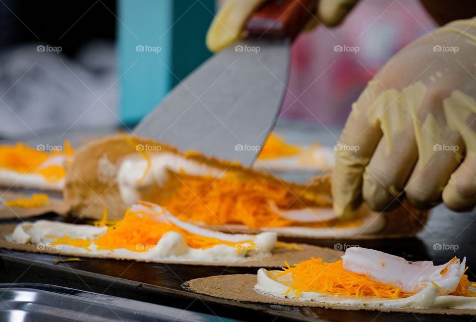 Delicious Thai crape cooking , Yellow floss made by sugar and yolk is very sweet