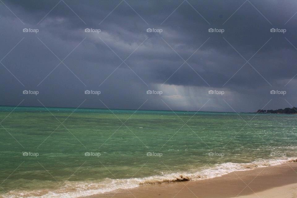 beach rain cloud sea by mariemank