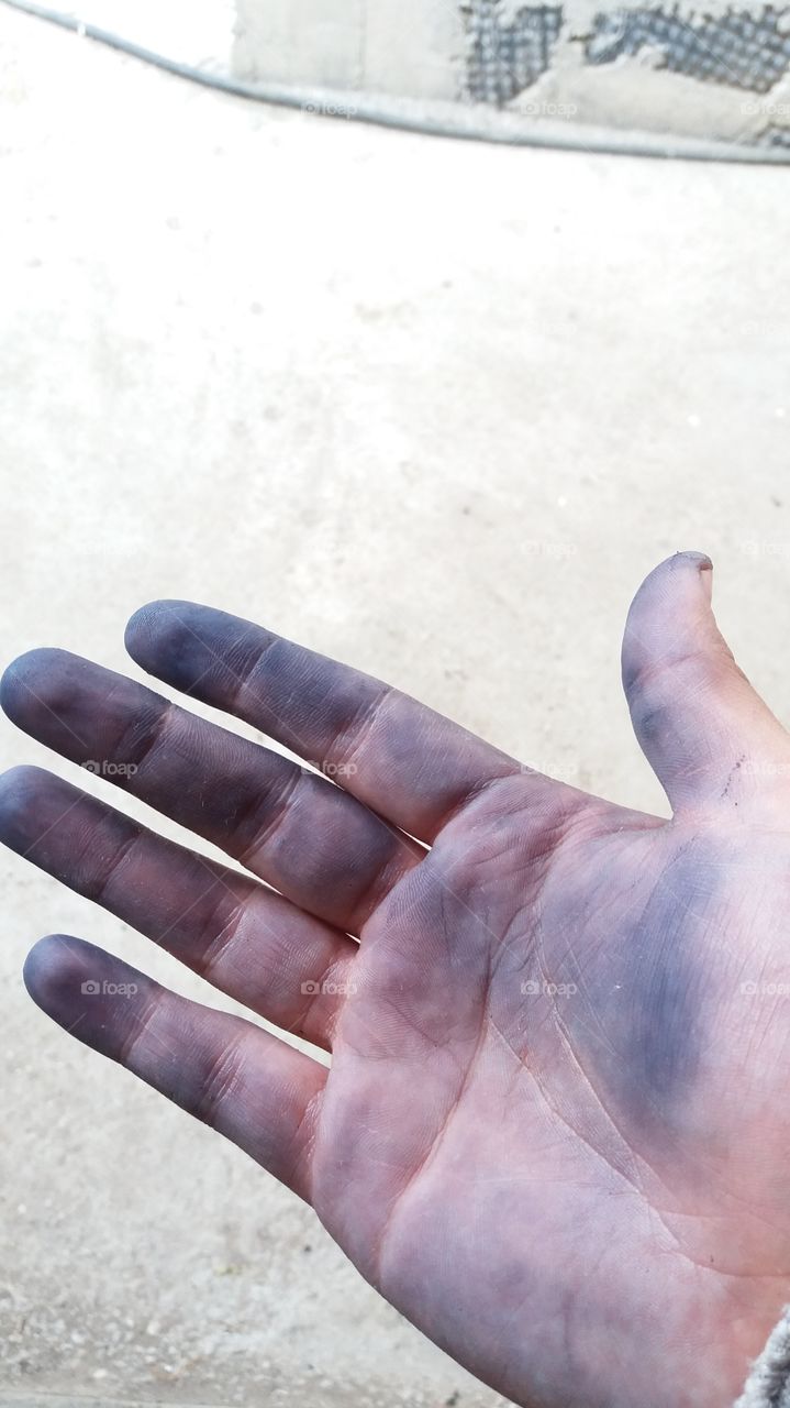 Stained hands after working with grapes