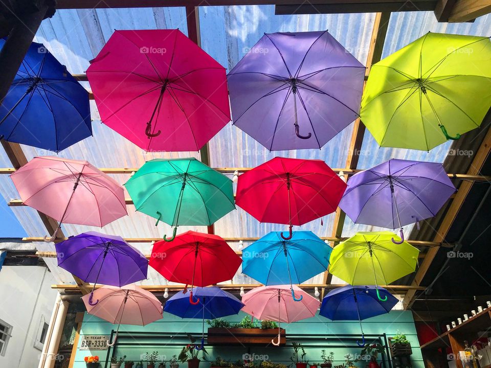 colorful umbrellas inside a beachfront bar in Florianópolis, Brazil