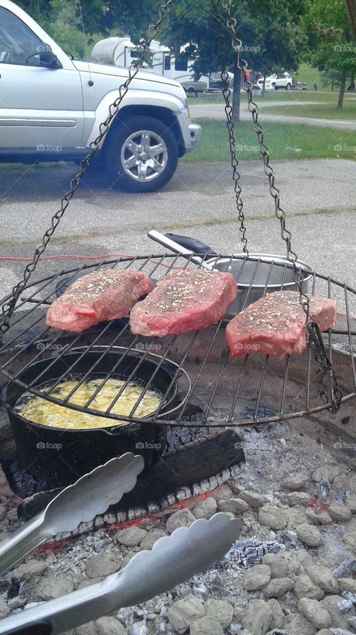 Steaks over a fire