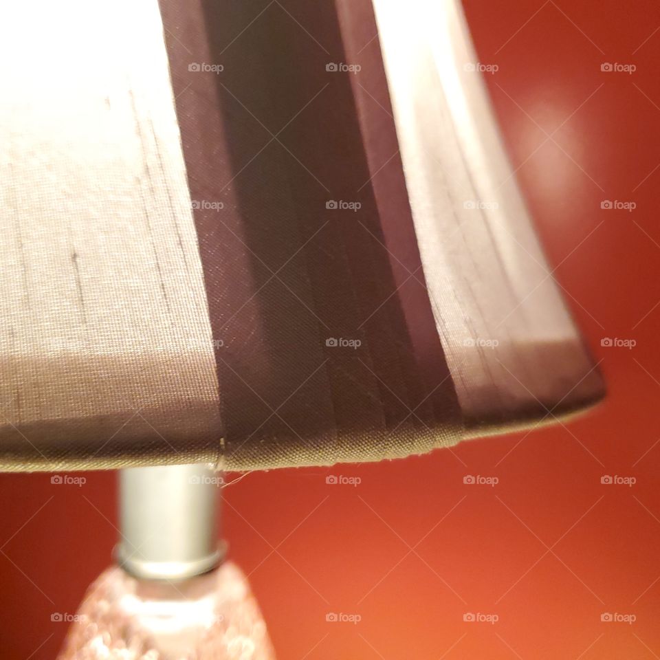 Lamp light against red wall