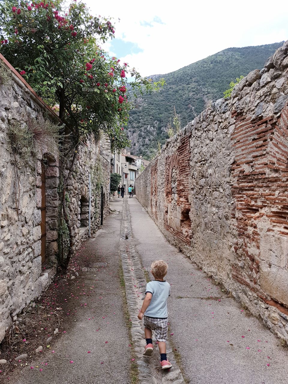 Boy running in alley