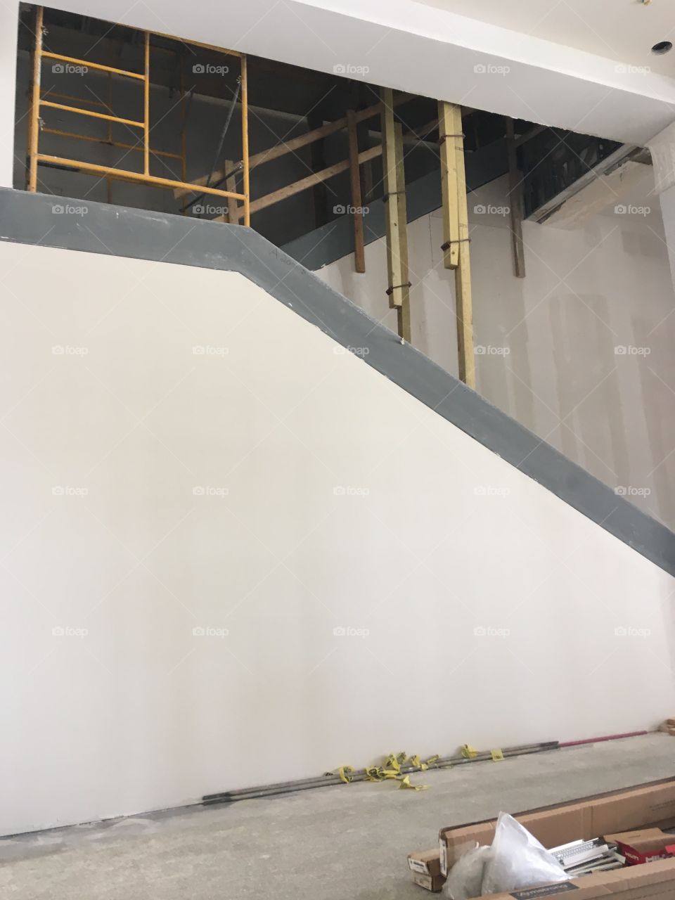 This is a picture of the crazy contraption we had to set up in order to reach places that I had to paint.