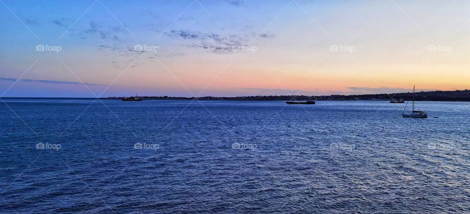 Blue sea and pink sunset