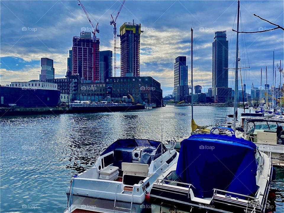 A view of “Newtown Creek” in LIC, Queens, NY. Across the “E River” two new high rise buildings are being built, especially noteworthy at night because of the spectacular illumination of the construction site. 2022. Hypnotic Productions