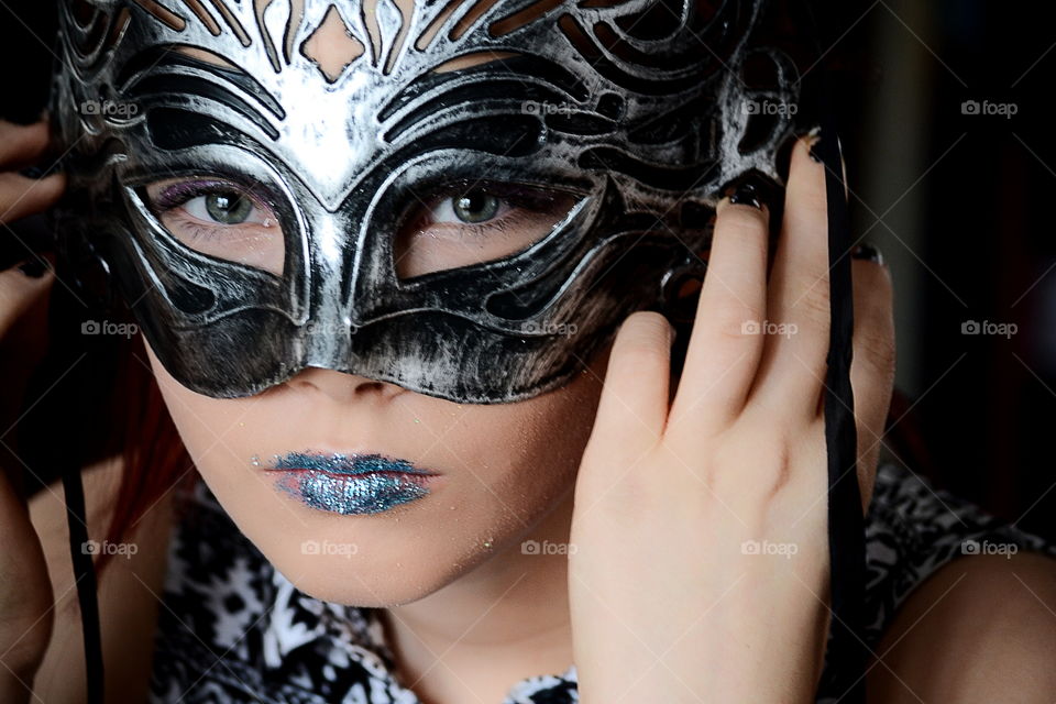 Close-up of a woman wearing carnival mask