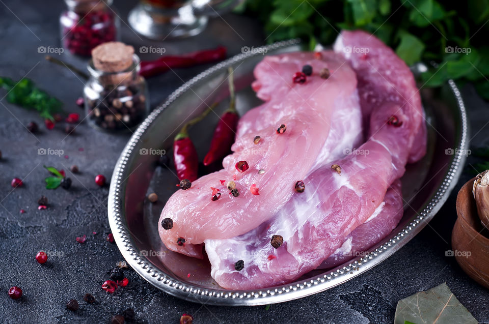 Raw pork meat with spices
