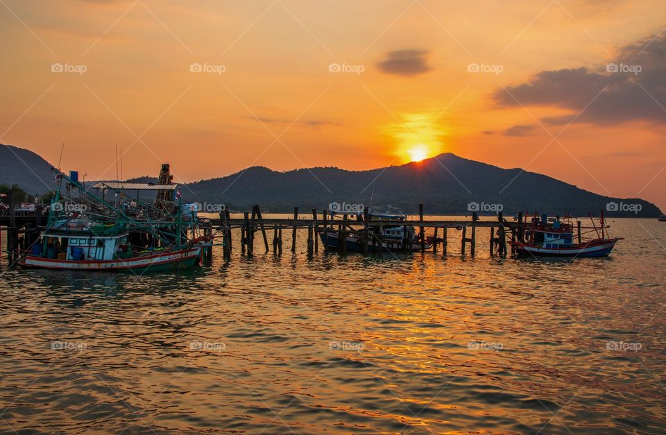 Thai Fisherman's Boats at a Fishing Pier in Bangsaray District Chonburi Thailand Southeast Asia during the Sunset Timeline