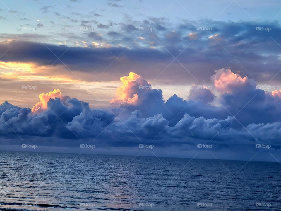 Beautiful puffy clouds along the waters