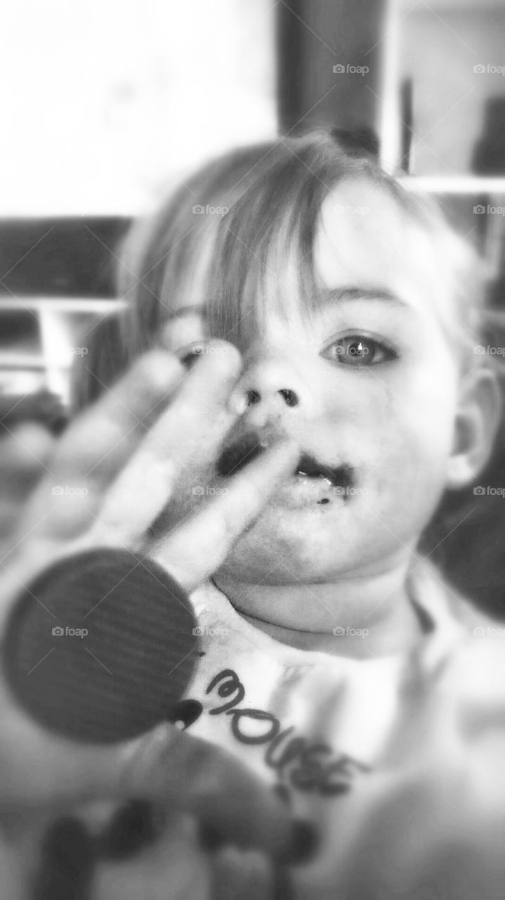 the hand of chocolate . granddaughter shows her magical chocolate power's 