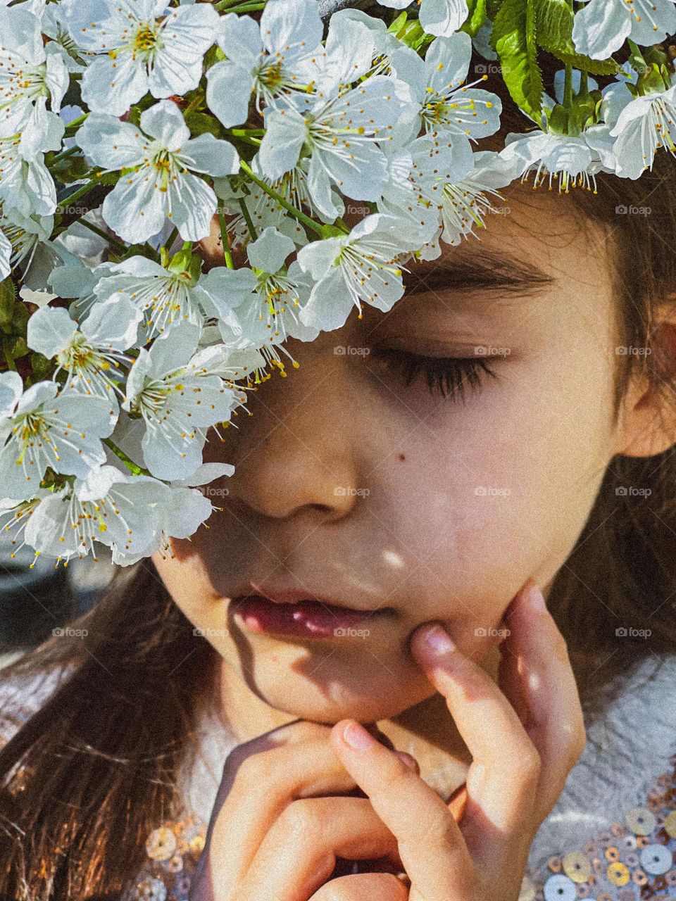 Girl with spring flowers on her face