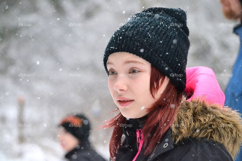 People outdoors in the snowfall