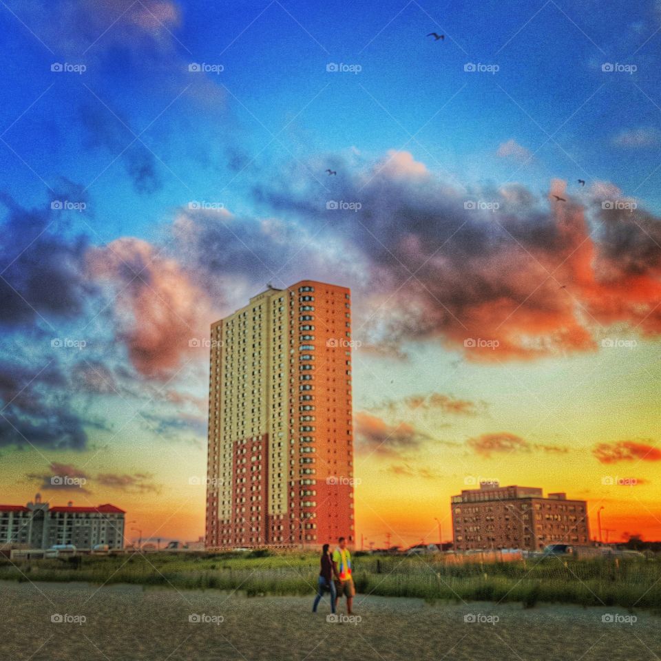 A Walk on The Beach . This photo captures the serenity of the golden hour in Asbury Park, NJ 