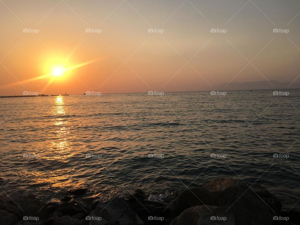 Sunset Sightseeing in Turkey. Blue sky and tall palm trees. Sunsets and sunny days. Summertime in Kusadasi. Vacation travel in Turkey . Summer view. Sunny day during vacation. Hidden gems and secret places.