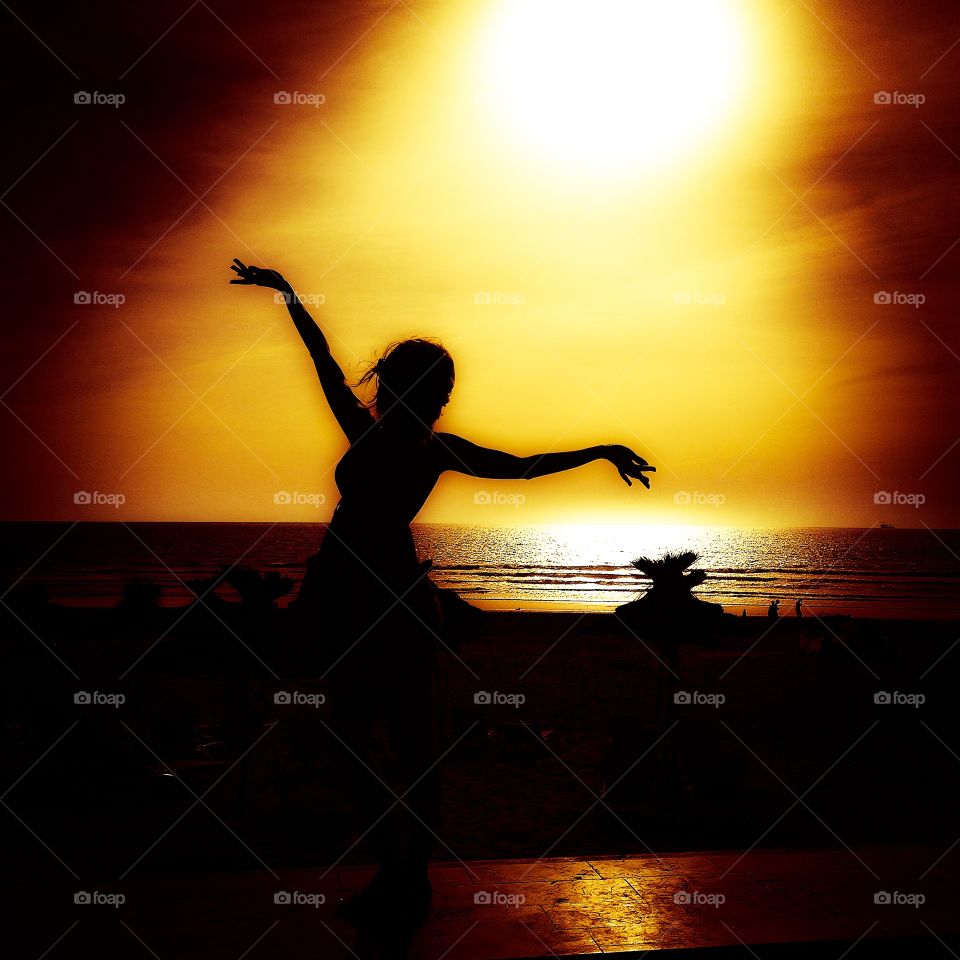 Young woman silhouette . Young woman silhouette on the beach