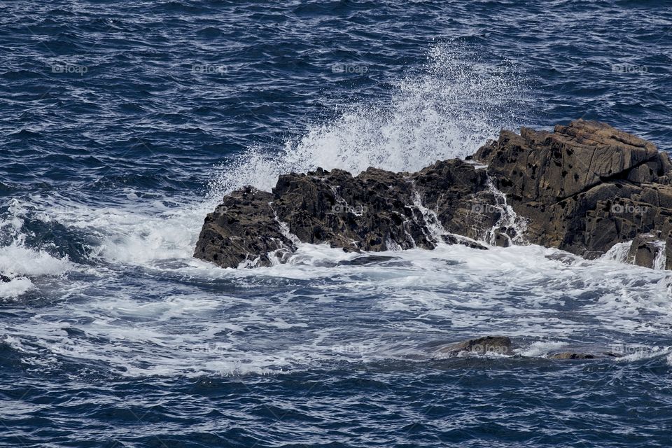 waves crashing on rocks