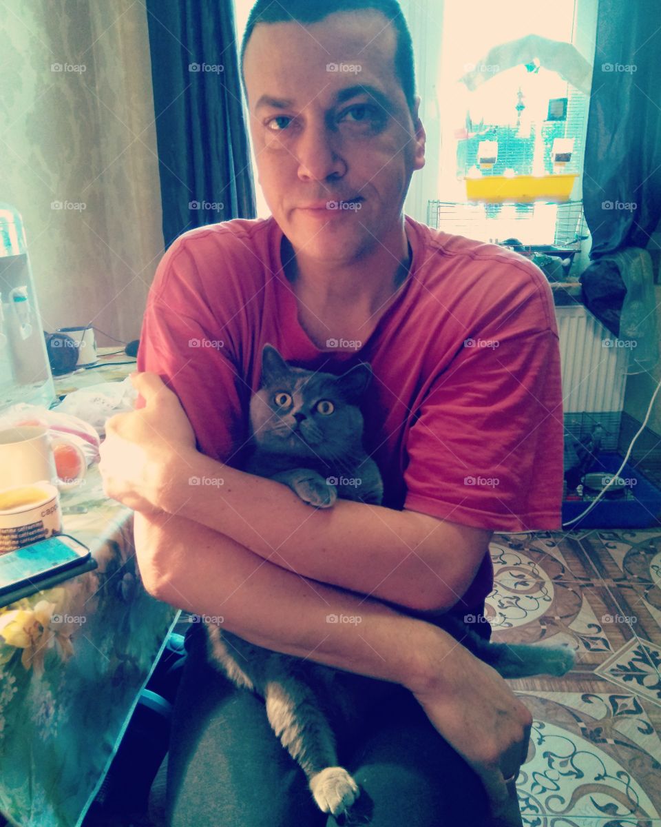 man and cat