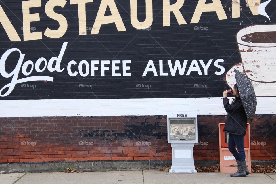 City mural good coffee with woman drinking coffee