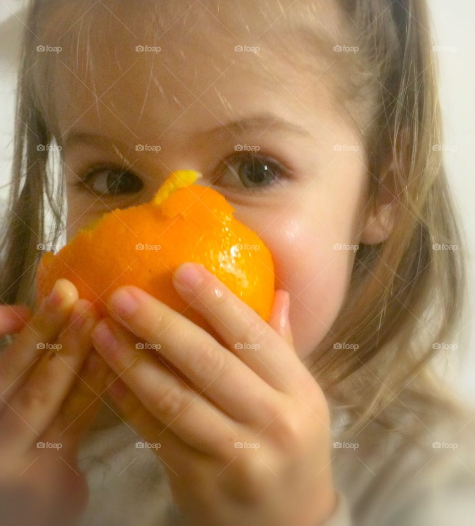 Girl Eating Orange