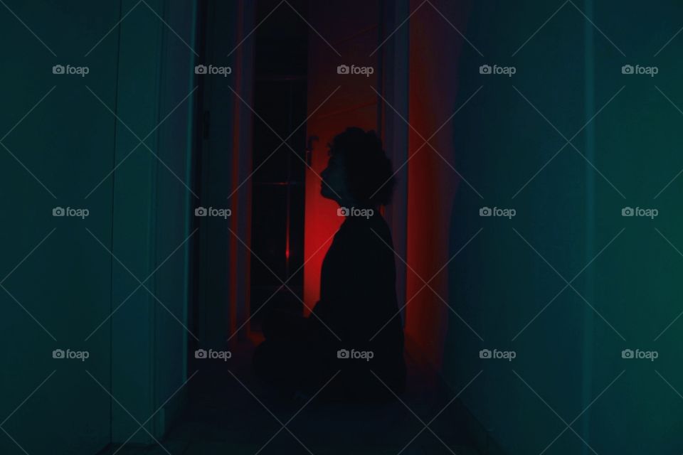 blue and red lights girl on the darkness