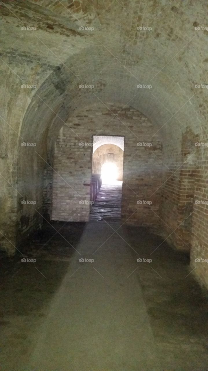 Ray of Light. Sunbeam captured inside the old fort in Pensacola Florida
