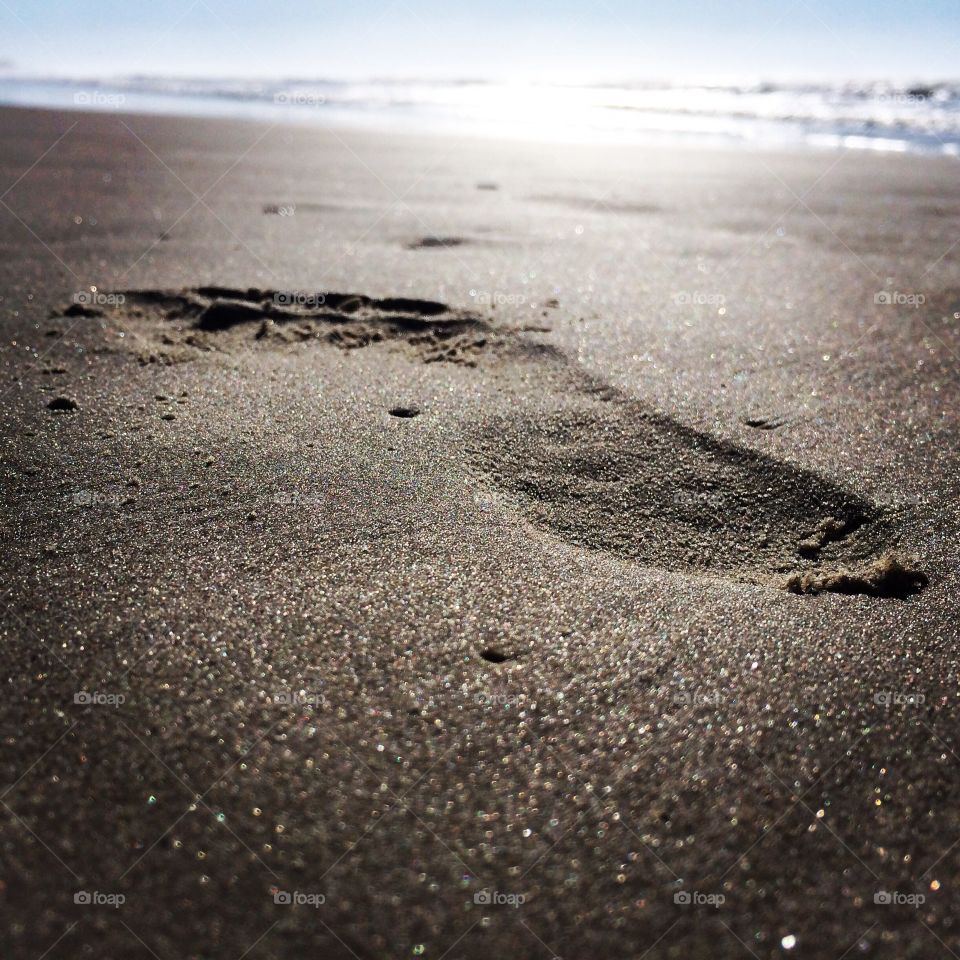 Step on Sand. A footprint on the sand - Caiobá Beach - Paraná State - Brazil