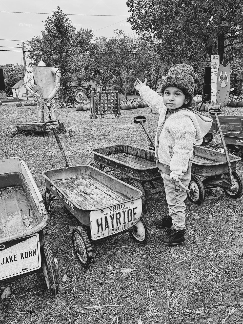Toddler girl shows the pumpkin patch to her mother, mommy and me time, hayride license plate, Ohio hayride license plate, little girl at the pumpkin patch
