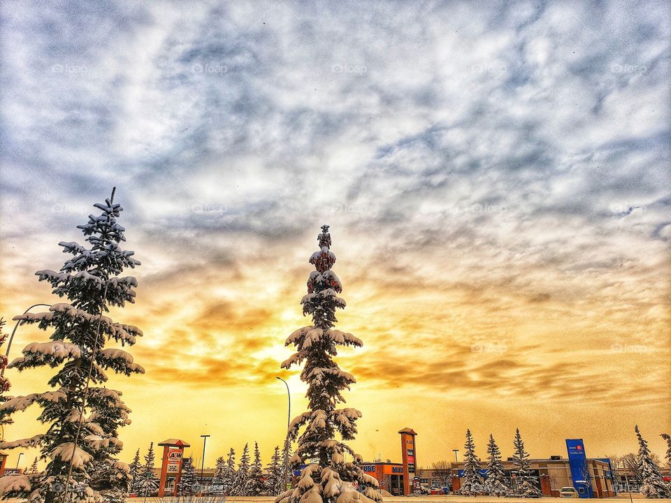 Blue and orange sky overtop the cityscape