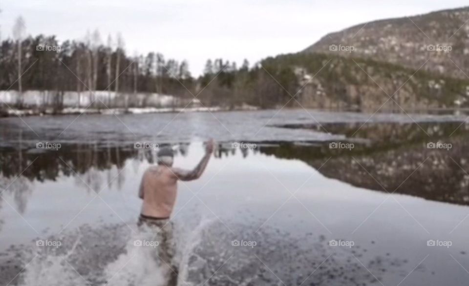 Crazy man bathing february