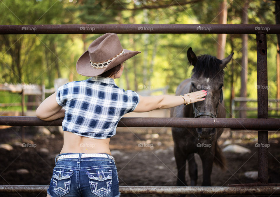 Girl cowboy and horse