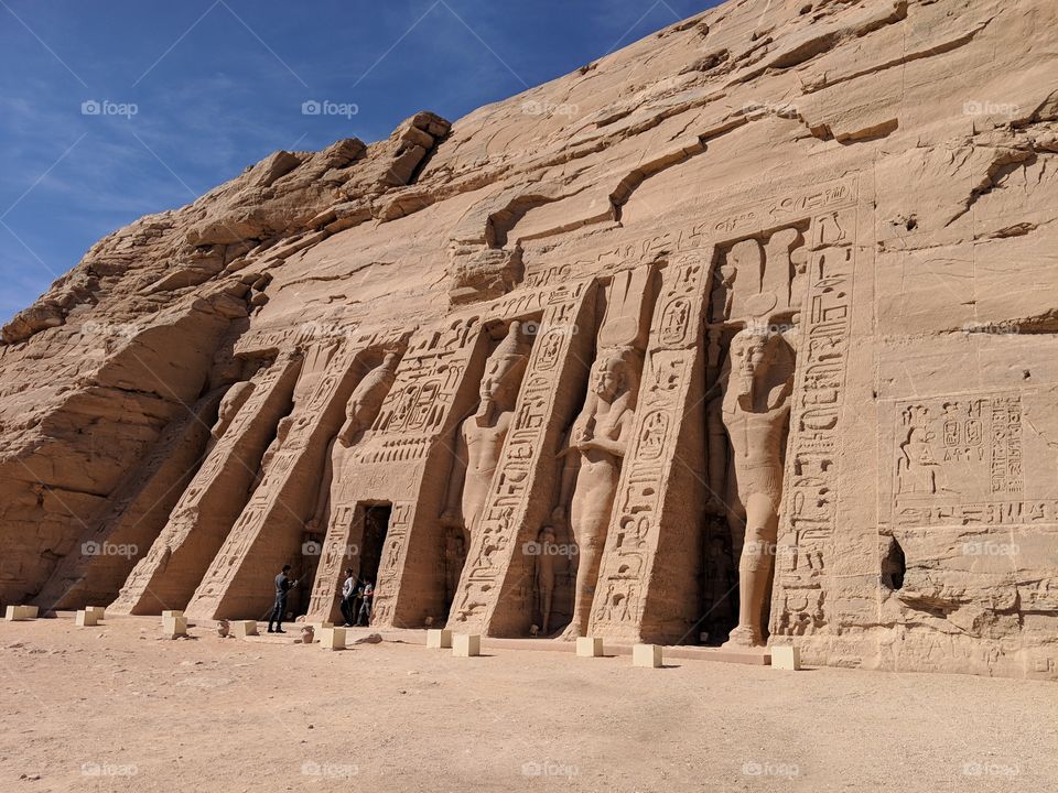 The Colossal statues guarding the smaller of the temples at the Temple of Abu Simbel