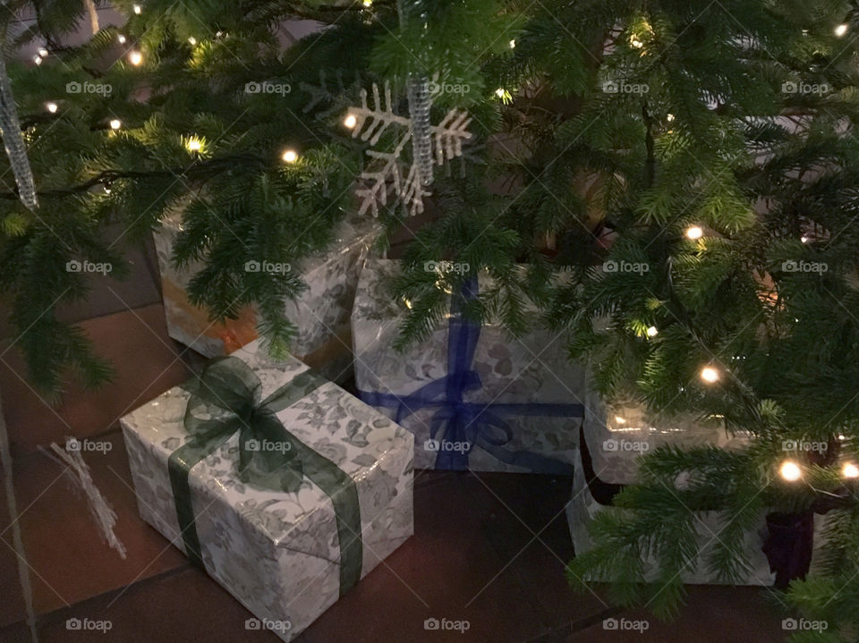 Christmas gifts under a Christmas tree

